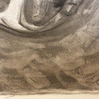 Detail of a black-and-white charcoal drawing showing handprint texture